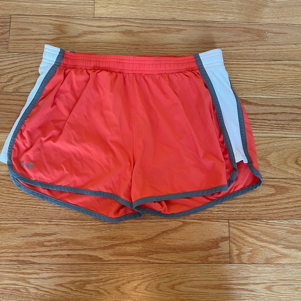 Under Armour woman’s size Med orange running lined shorts